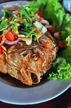 Thai food fried fish with spicy sauceの写真素材