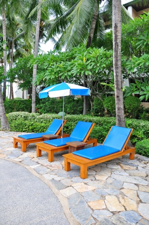 Beach chairs side swimming poolの写真素材