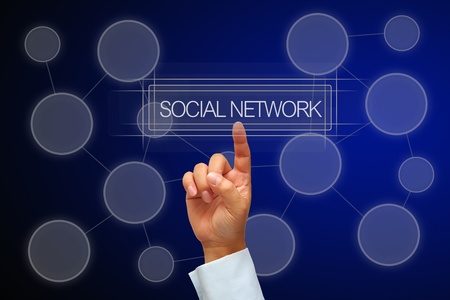 Hand pressing button social network with human iconの写真素材