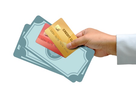 Hand holding credit card with money isolated on white backgroundの写真素材