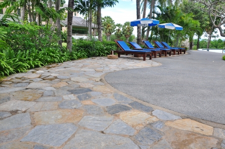 Beach chairs side swimming poolの写真素材
