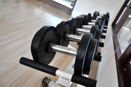 Many black dumbbell in the fitness roomの写真素材