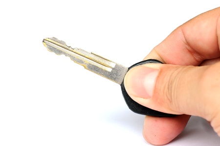 Car key with hand isolated on the white background