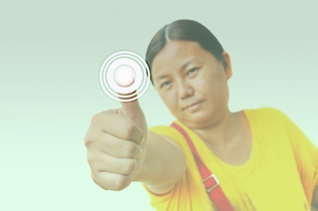 Portrait of asia woman pressing the buttonの写真素材