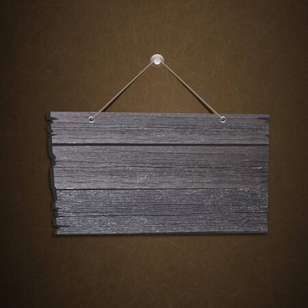 Empty wooden sign hanging on a rope and Blackboard backgroundの写真素材
