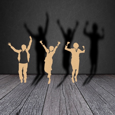 Paper cut of  business man on wood grain with black shadowの写真素材