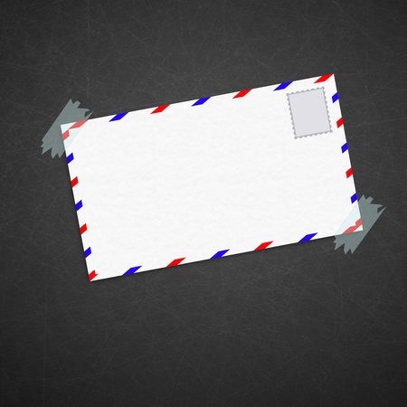 Envelope and stamp isolated on blackboard background