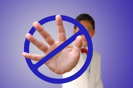 Portrait of Business man making stop gesture on blue backgroundの写真素材