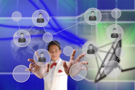 Businessman pushing people Social Network on the Satellite dish transmission data backgroundの写真素材