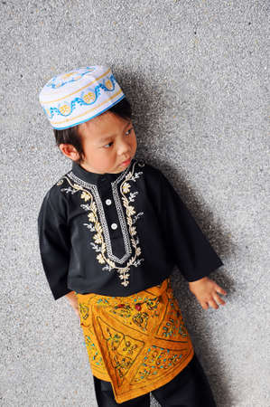 Portrait of asian boy with smile in malaysia dressの写真素材