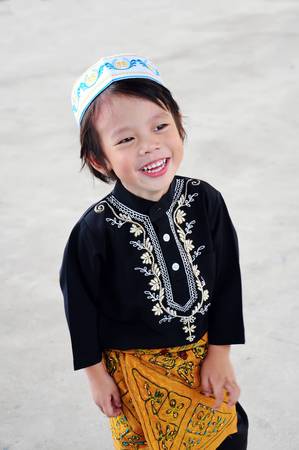 Portrait of asian boy with smile in malaysia dressの写真素材