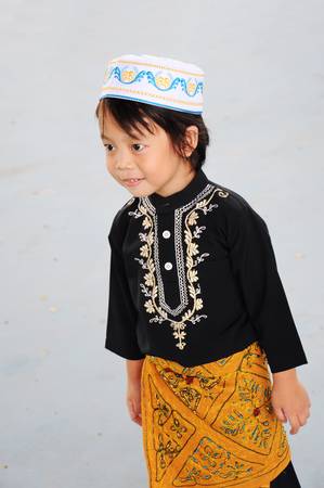 Portrait of asian boy with smile in malaysia dressの写真素材