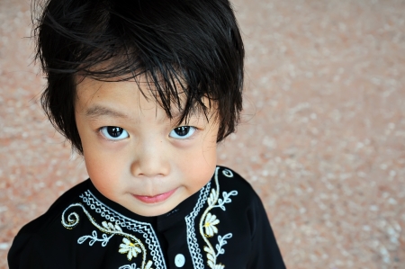 Portrait of asian boy with smile gestureの写真素材