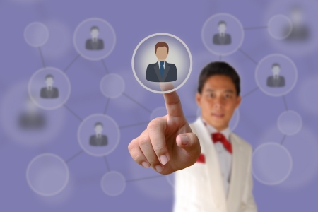 Businessman pushing human button and Social Network on the blue backgroundの写真素材
