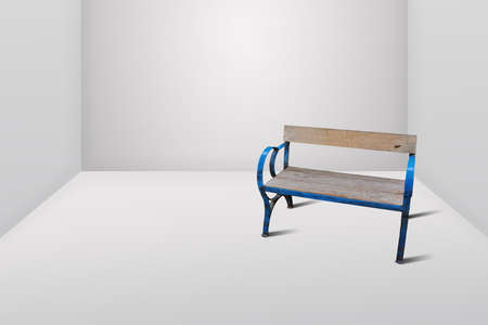 Empty wooden bench in the empty white roomの写真素材