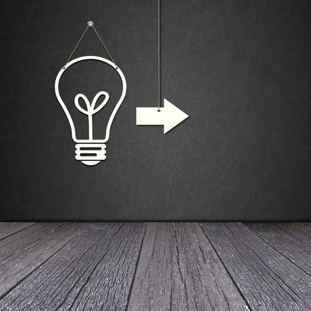 Paper bulb lamp on the blackboard with ground of the woodの写真素材