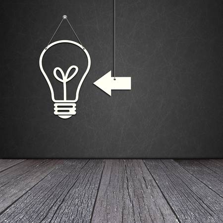 Paper bulb lamp on the blackboard with ground of the woodの写真素材