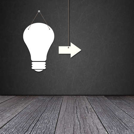 Paper bulb lamp on the blackboard with ground of the woodの写真素材
