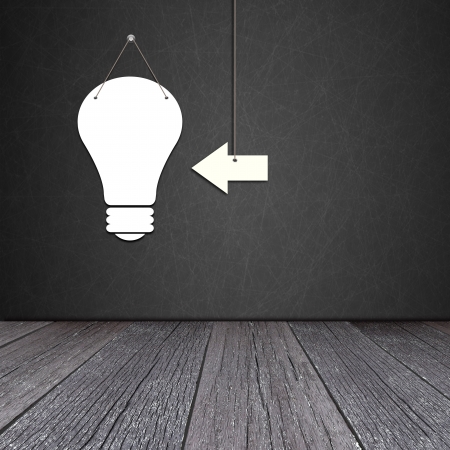 Paper bulb lamp on the blackboard with ground of the woodの写真素材