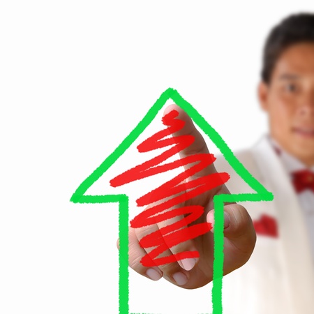 Business man pressing the arrow on the white backgroundの写真素材