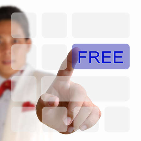 Free button on keyboard with finger pushing a buttonの写真素材