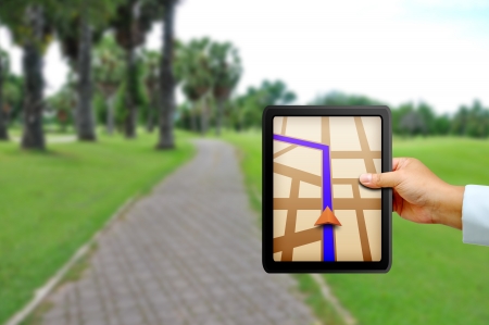 Male hand holding a touchpad gpsの写真素材