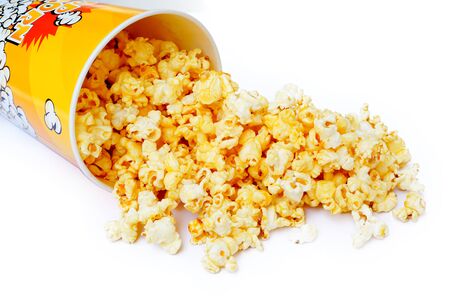 Popcorn in cardboard box isolated on white backgroundの写真素材