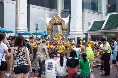BANGKOK, THAILAND - JUNE 19, 2015: Tourists at Erawan Shrine, Grand Hyatt Erawan Hotel Ratchaprasong Junction.のeditorial素材