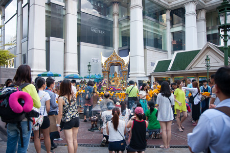 BANGKOK, THAILAND - JUNE 19, 2015: Tourists at Erawan Shrine, Grand Hyatt Erawan Hotel Ratchaprasong Junction.のeditorial素材