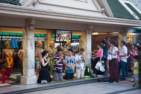 BANGKOK, THAILAND - JUNE 19, 2015: Thai dance troupes hired by worshipers perform Thai dance to pay respect to the Erawan Shrine, Grand Hyatt Erawan Hotel Ratchaprasong Junction.のeditorial素材