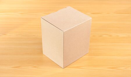 Blank Brown Paper Box  mock up on wood tableの写真素材