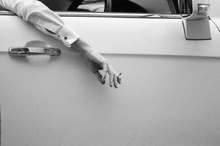 Smoking cigarette during traffic jam, Toned image