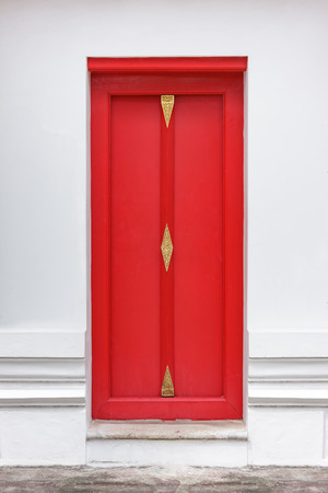 Wooden red door on White Wall.の写真素材