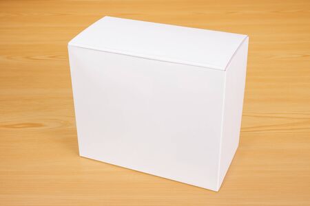 Blank white box mock up on wood backgroundの写真素材