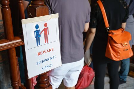 Bangkok, Thailand - September 7, 2018: The sign warns tourists to beware the pickpocket gangs at Wat...