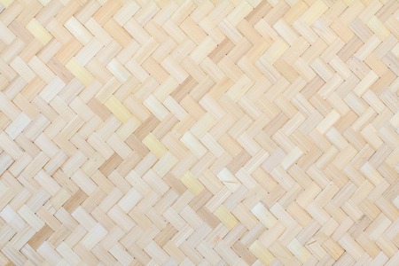 Closeup brown bamboo weaving texture, Woven wood pattern of thailand for background and design.の写真素材
