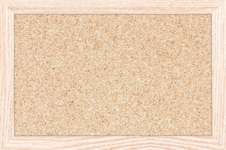 Empty bulletin board with a wooden frame, cork board texture, blank corkboard.の写真素材
