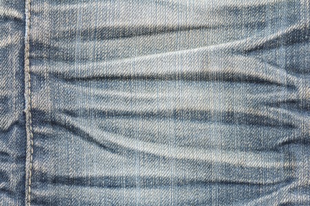 Denim jeans texture or denim jeans background with seam. Old grunge vintage denim jeans. Stitched...