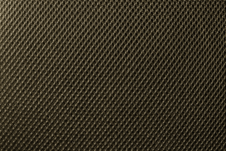 Deep yellow fishnet cloth material as a texture background. Nylon texture pattern or nylon...