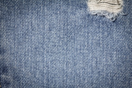 Denim jeans texture or denim jeans background with old torn. Old grunge vintage denim jeans. Stitched texture denim jeans background of fashion jeans design. Dark edged.の写真素材