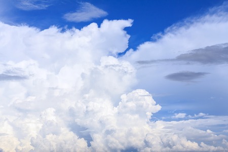 Blue sky background with white clouds and rain clouds. The vast blue sky and clouds sky on sunny...