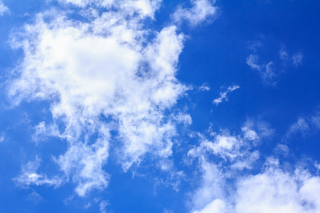 Blue sky with white clouds. The vast blue sky and clouds sky on sunny day. White fluffy clouds in the blue sky.の写真素材