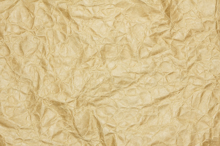 Recycled crumpled brown paper texture or paper background for design with copy space for text or image.の写真素材