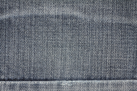 Denim jeans texture or denim jeans background with seam. Old grunge vintage denim jeans. Stitched...