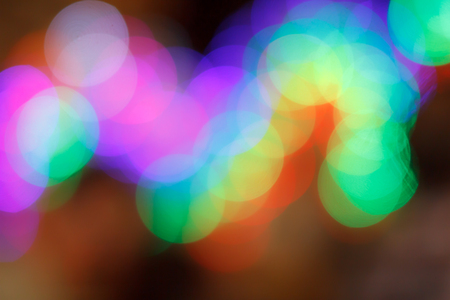 Colorful abstract blurred circular bokeh light of night city street for background. graphic design...
