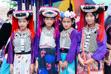 Doi Mae Salong, Chiang Rai - THAILAND, September 8, 2018 : Lisu hill-tribe preteen girl wears traditional tribal attire with black circular Lisu headdress on Akha Swing Festival 2018.のeditorial素材