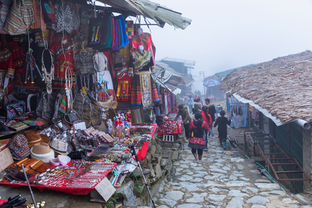 Sapa, Vietnam - March 7, 2019 : View of people traveling at Cat Cat village, in the rainy and foggy morning Laocai province, Sapa, Vietnam.のeditorial素材