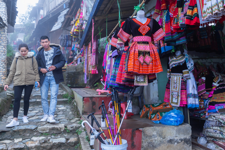 Sapa, Vietnam - March 7, 2019 : View of people traveling at Cat Cat village, in the rainy and foggy morning Laocai province, Sapa, Vietnam.のeditorial素材