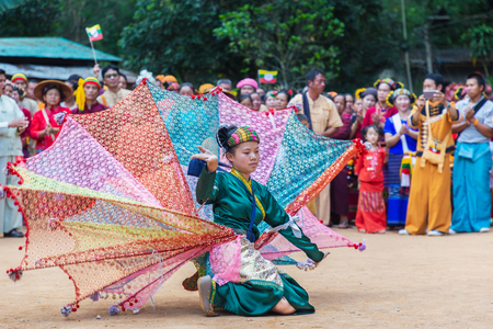 Thoet Thai, Chiang Rai - THAILAND, December 12, 2018 : Group of Shan or Tai Yai (ethnic group living in parts of Myanmar and Thailand) in tribal dress do native dancing in Shan New Year celebrations.のeditorial素材