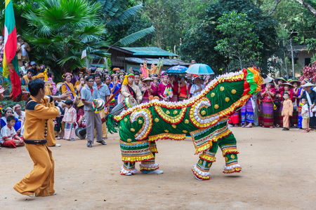 Thoet Thai, Chiang Rai - THAILAND, December 12, 2018 : Group of Shan or Tai Yai (ethnic group living in parts of Myanmar and Thailand) in tribal dress do native dancing in Shan New Year celebrations.のeditorial素材